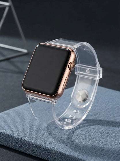 A square digital sports watch with a transparent band resting on a slate blue surface against a dark charcoal background.